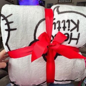 Hello kitty full/queen blanket. Fits a king size bed also.